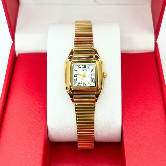 montre pour femme dorée 

